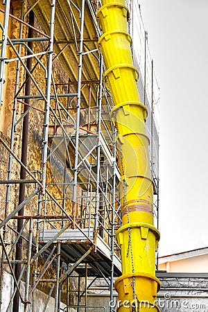 Discharge debris tube yard building Stock Photo