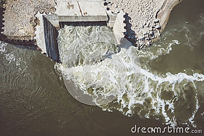 Discharge of sewage into the river Stock Photo