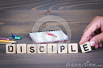 Disciple from wooden letters on wooden background Stock Photo