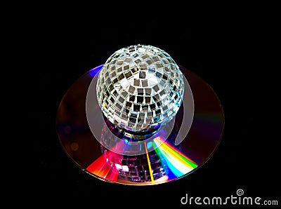 Disco ball over music CD on black Stock Photo