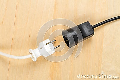 Disconnected white european power cable plug with black connector cable Stock Photo