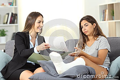 Discontent disabled woman with insurance policies Stock Photo