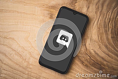 Discord is instant messaging platform. Users communicate with voice calls, video calls, text messaging, media and files in private Editorial Stock Photo