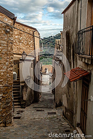 Discover the Charm of Rocca Imperiale: Italian Street with Old Houses, Stone Floors, and a Beautiful medieval Street Stock Photo