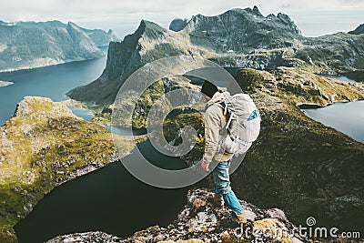 Discoverer man standing on cliff mountain in Norway Stock Photo