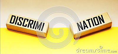 Discrimination is a wooden block word with letters, Stock Photo