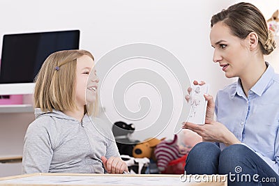 Discussing drawing during play therapy Stock Photo