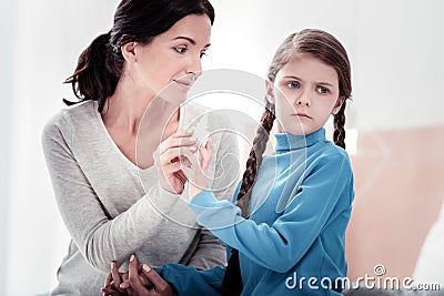 Portrait of careful mother and fussy child Stock Photo