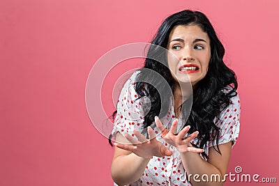 Disgusted face expression with young woman Stock Photo
