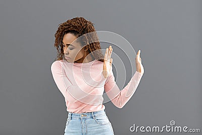 Disgusted mixed race young woman with squeamish expression Stock Photo