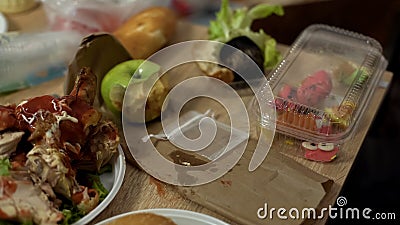 Disgusting dirty plates full of unhealthy food leftovers after student party Stock Photo