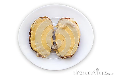 Disgusting sandwiches lying on a white plate. Unhealthy breakfast. Stock Photo