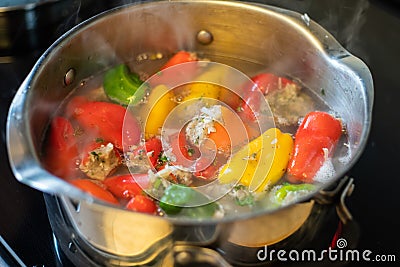 Bell peppers stuffed with rice and meat. Stock Photo