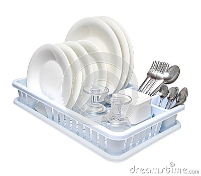 Dish drainer with clean dinnerware Stock Photo