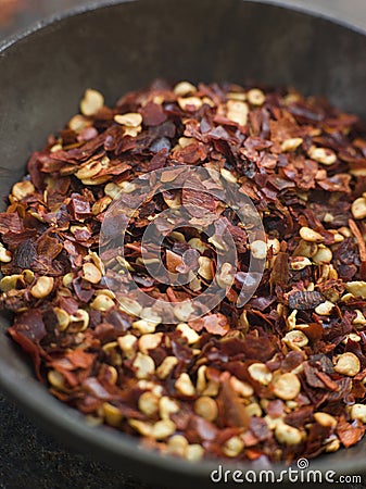 Dish of Dried Chili Flakes Stock Photo