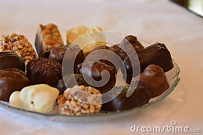 Dish full of luscious assorted chocolates Stock Photo