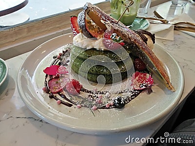 A dish of green tea pancake with a variety of fruits Stock Photo