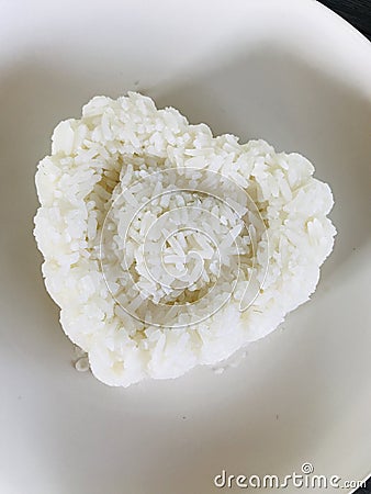 Dish of heart-shaped rice. Stock Photo