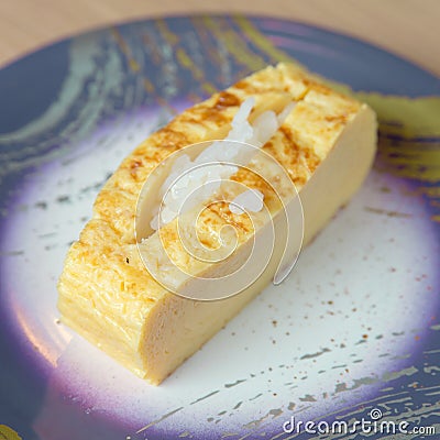 Dish of Rolled Dashi Omelette filled with rice Stock Photo