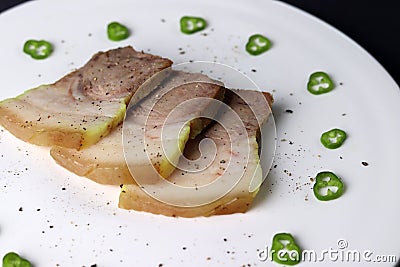 A dish made by boiling pork in water. Stock Photo