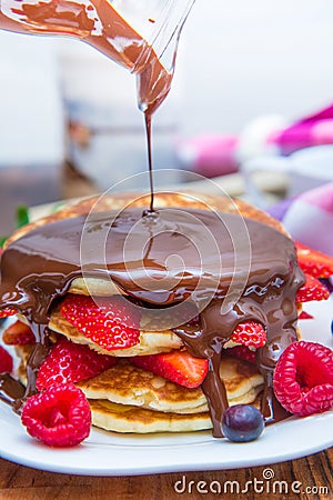 Dish with pancakes and strawberry,raspberry Stock Photo