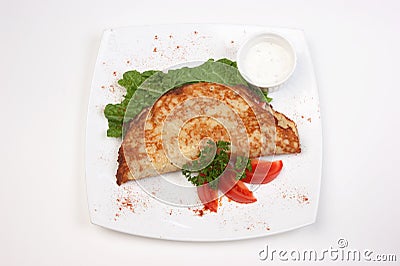 Dish of pancakes and vegetables Stock Photo