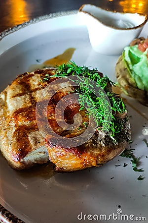 A dish of pork medallion with dill close-up with sauce Stock Photo