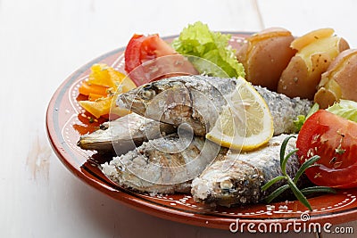 Dish of portuguese sardines on a table Stock Photo