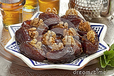 Dish with preserved Medjool dates Stock Photo