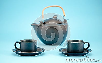 Dish retro tea pot cups saucers morning drink blue Stock Photo