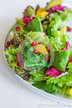 Dish salad slicing fresh greens spinach avocado Stock Photo