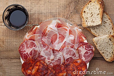 Dish of sliced smoked ham and sausage Stock Photo