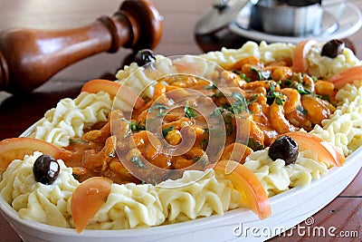 Pirarucu steak with shrimp sauce. Stock Photo