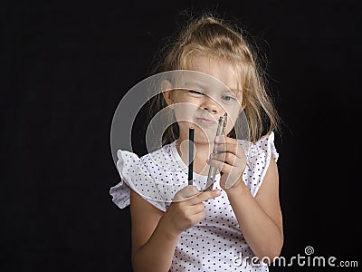 Disheveled girl looks at compass Stock Photo