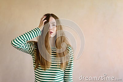 Dishevelled woman in a striped vest Stock Photo