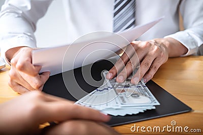 Dishonest cheating in business illegal money, Businessman giving bribe money in business people to give success the deal contract Stock Photo