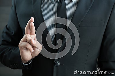 Dishonesty, Business fraud concept, Businessman showing fingers Stock Photo