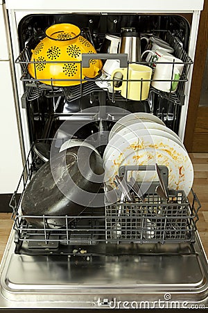 Dishwasher with filthy dishware Stock Photo