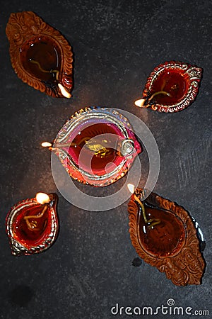 Disigning diyas with verious designed diya burning Stock Photo