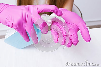 Disinfection hands before manicure in the salon Stock Photo