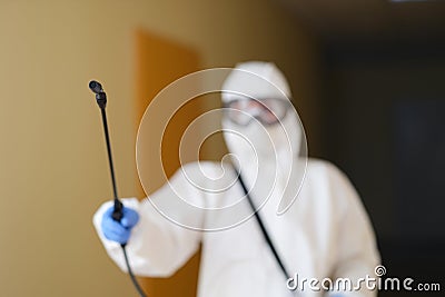 Disinfection specialist with spray bottle, close-up Stock Photo