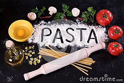 On the disintegrating written flour pasta, tomatoes, mushrooms and herbs. Stock Photo