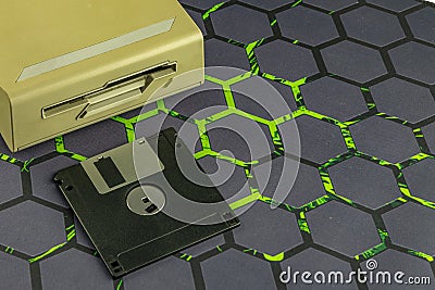Disk drive from an old computer, colorful 3.5-inch floppy disks Stock Photo