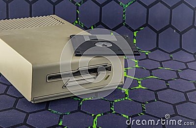 Disk drive from an old computer, colorful 3.5-inch floppy disks Stock Photo