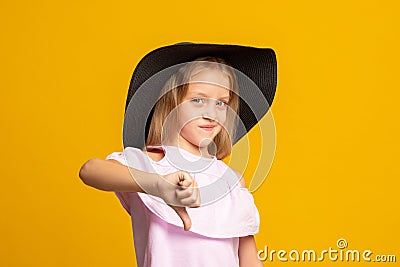 Dislike gesture skeptik child wrong choice girl Stock Photo