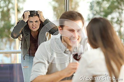 Disloyal boyfriend caught by his angry girlfriend Stock Photo
