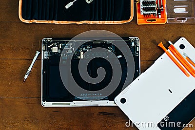 Dismantle laptop with tools and battery, display, hard disk and other components Stock Photo