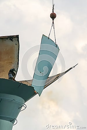 Dismantling of an old water tower on a beautiful summer`s day by torches and a large crane. This water tower was located in Ann Ar Stock Photo