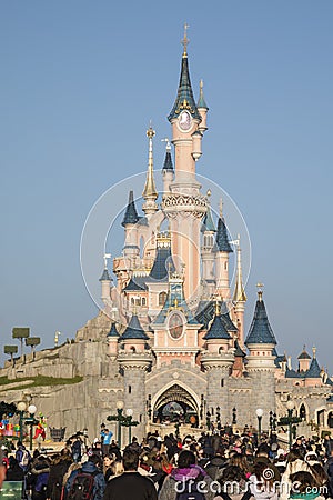 Disneyland Paris, France, November 2018: Tourist crowd Sleeping Beauty`s Castle Editorial Stock Photo
