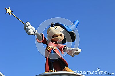 A close-up on the statue of Mickey Mouse in Disneyland Paris, France - isolated blue background Editorial Stock Photo